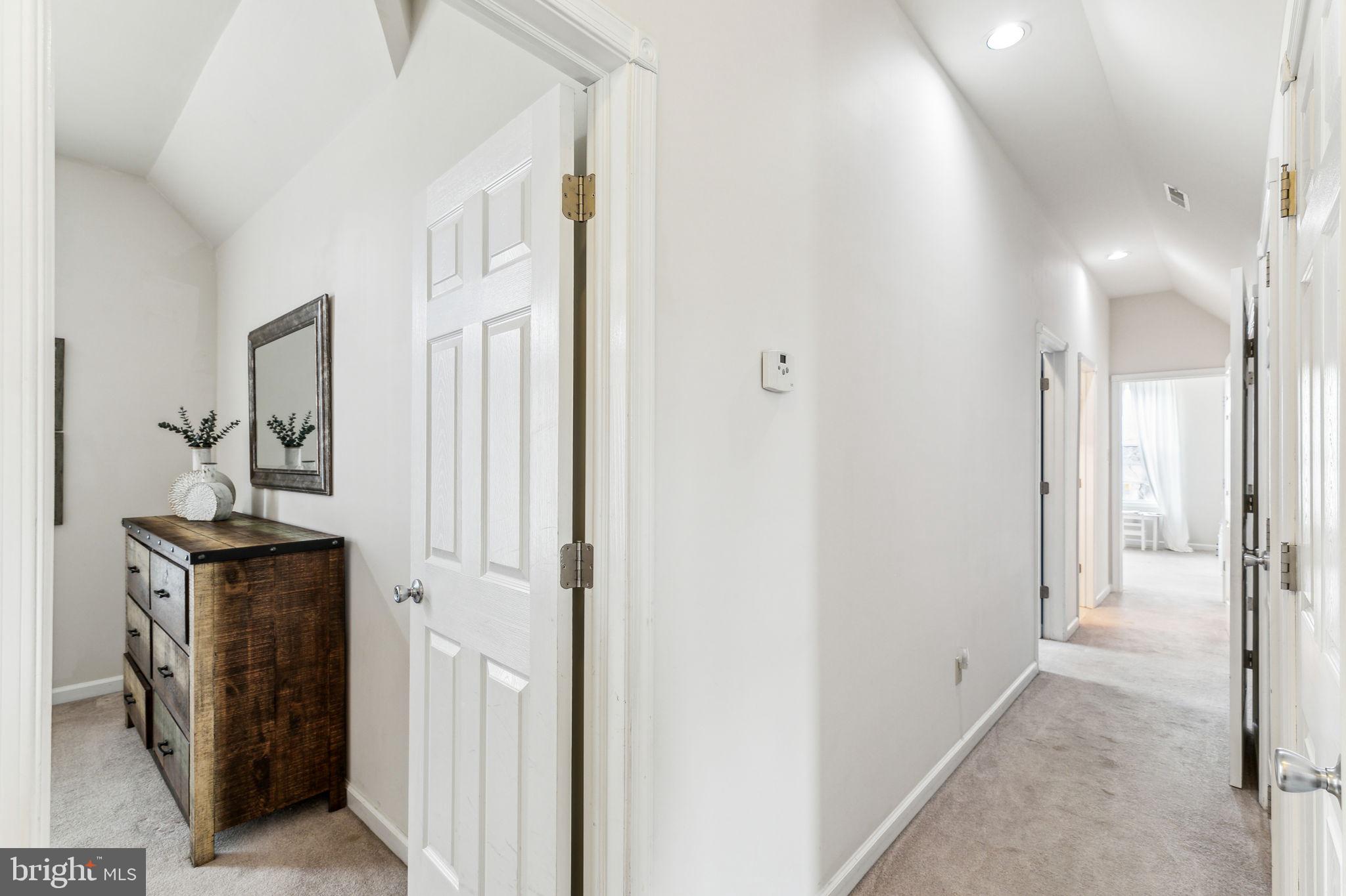 316 Blakeley Road Wallingford, PA 19086 - Photo 20 of 34 a view of a hallway with a livingroom and a bathroom