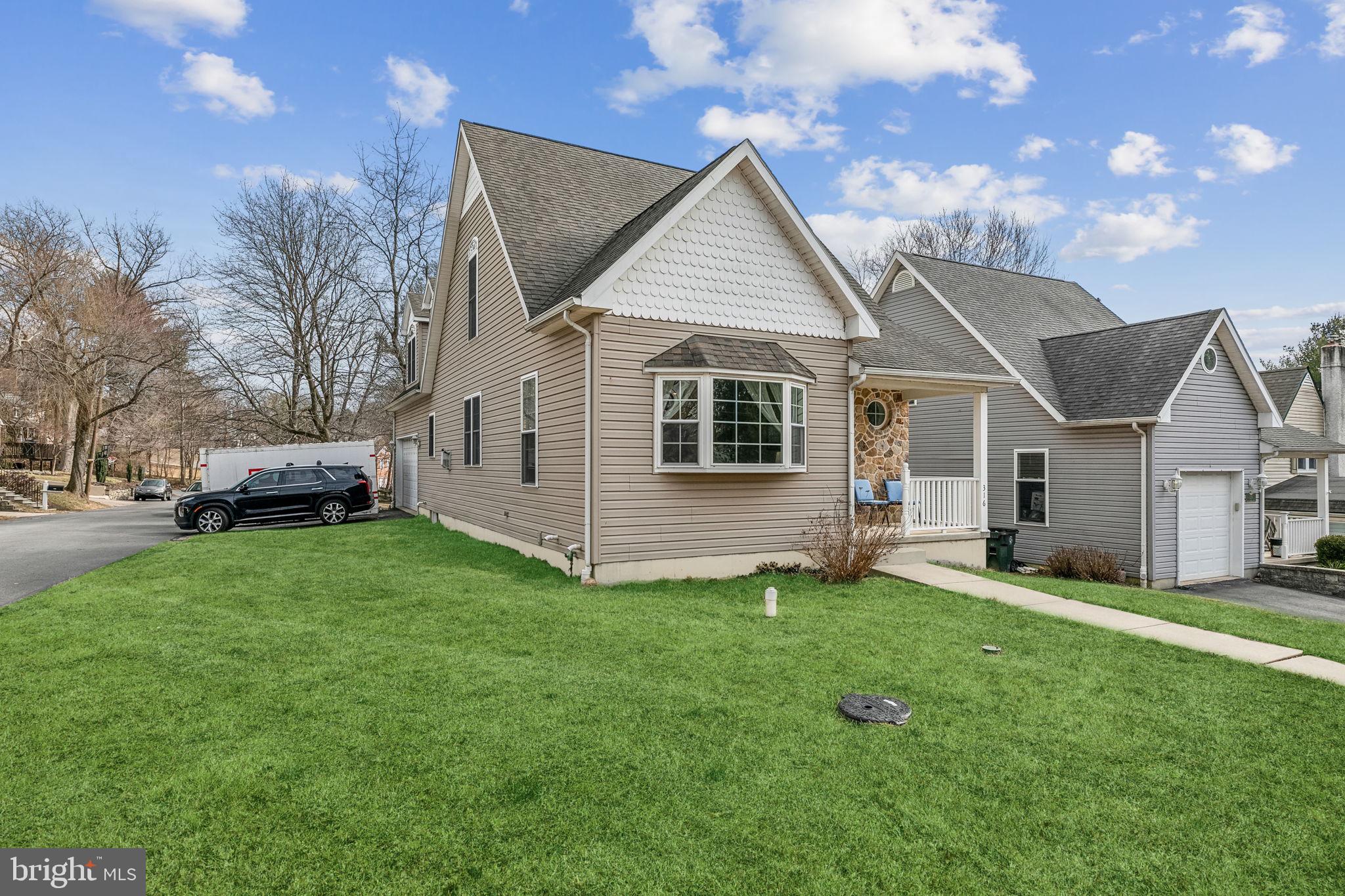 316 Blakeley Road Wallingford, PA 19086 - Photo 2 of 34 a view of a yard in front of house