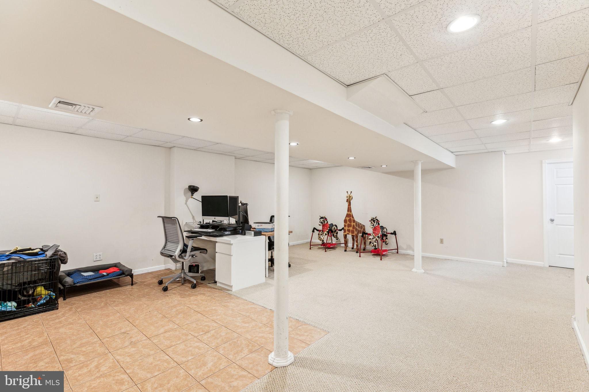 316 Blakeley Road Wallingford, PA 19086 - Photo 29 of 34 a room with furniture and a flat screen tv