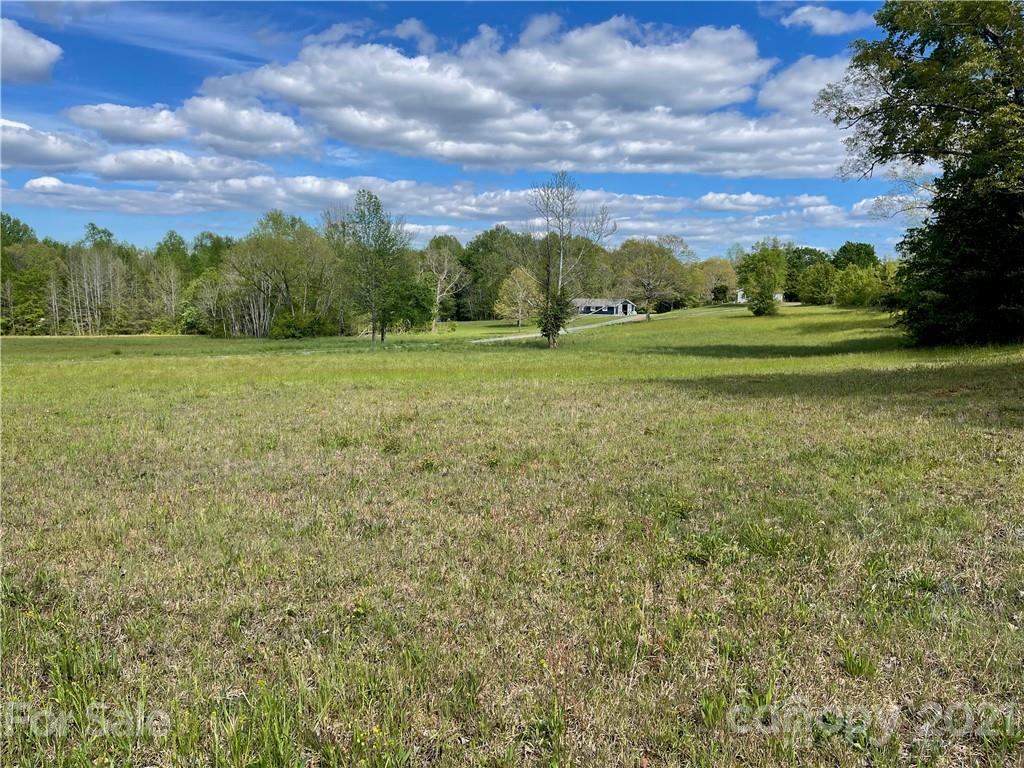 4365 Landrum Road, Unit 2 Columbus, NC 28722 - Photo 5 of 9 a view of a field with an trees