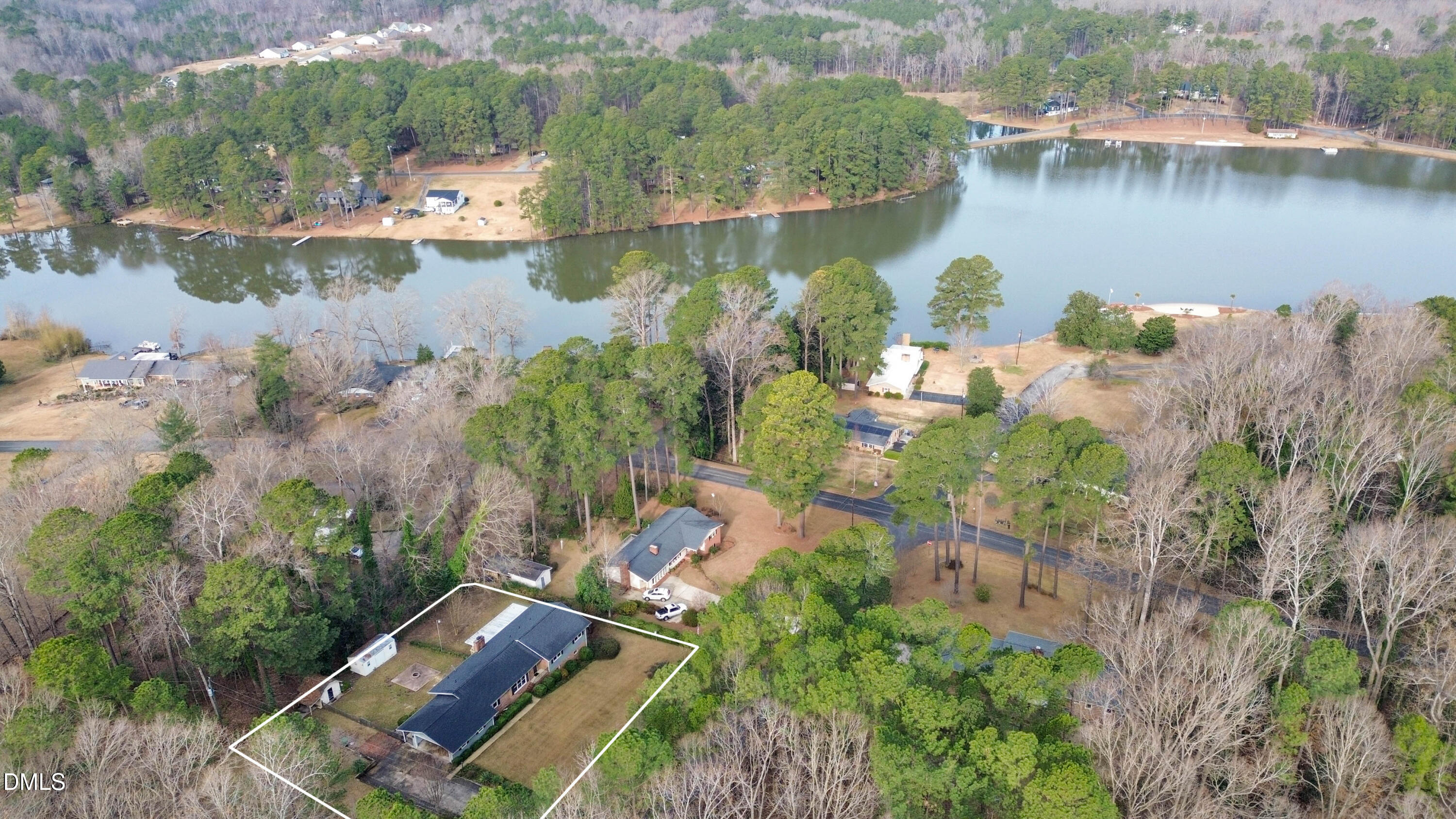 an aerial view of a house with a lake view