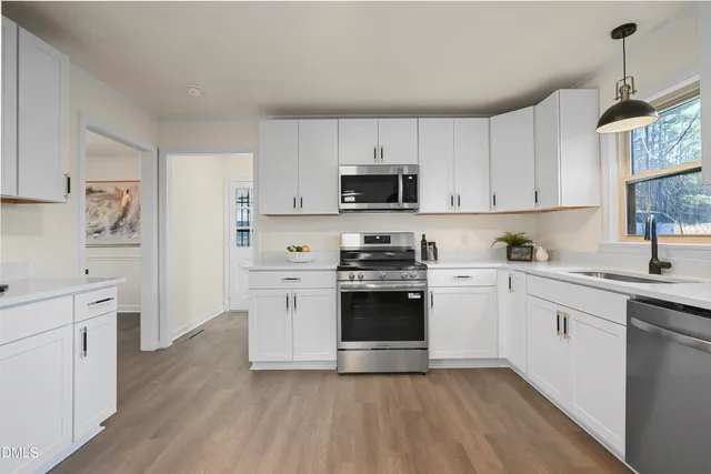 a living room with furniture a table and a window