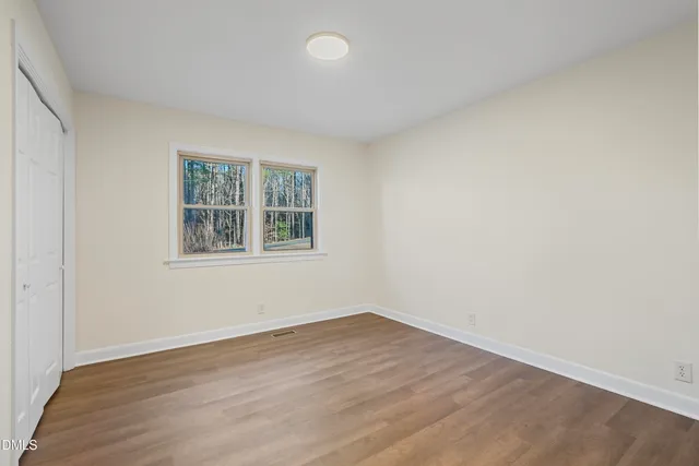 a bathroom with a granite countertop bathtub