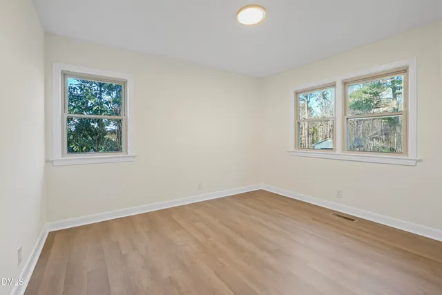 a living room with furniture and stairs