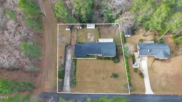 an aerial view of a house with a lake view