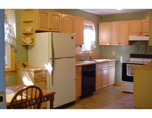 1469 Richardson Road Ashby, MA 01431 - Photo 5 of 6 a kitchen with a sink a refrigerator and a stove