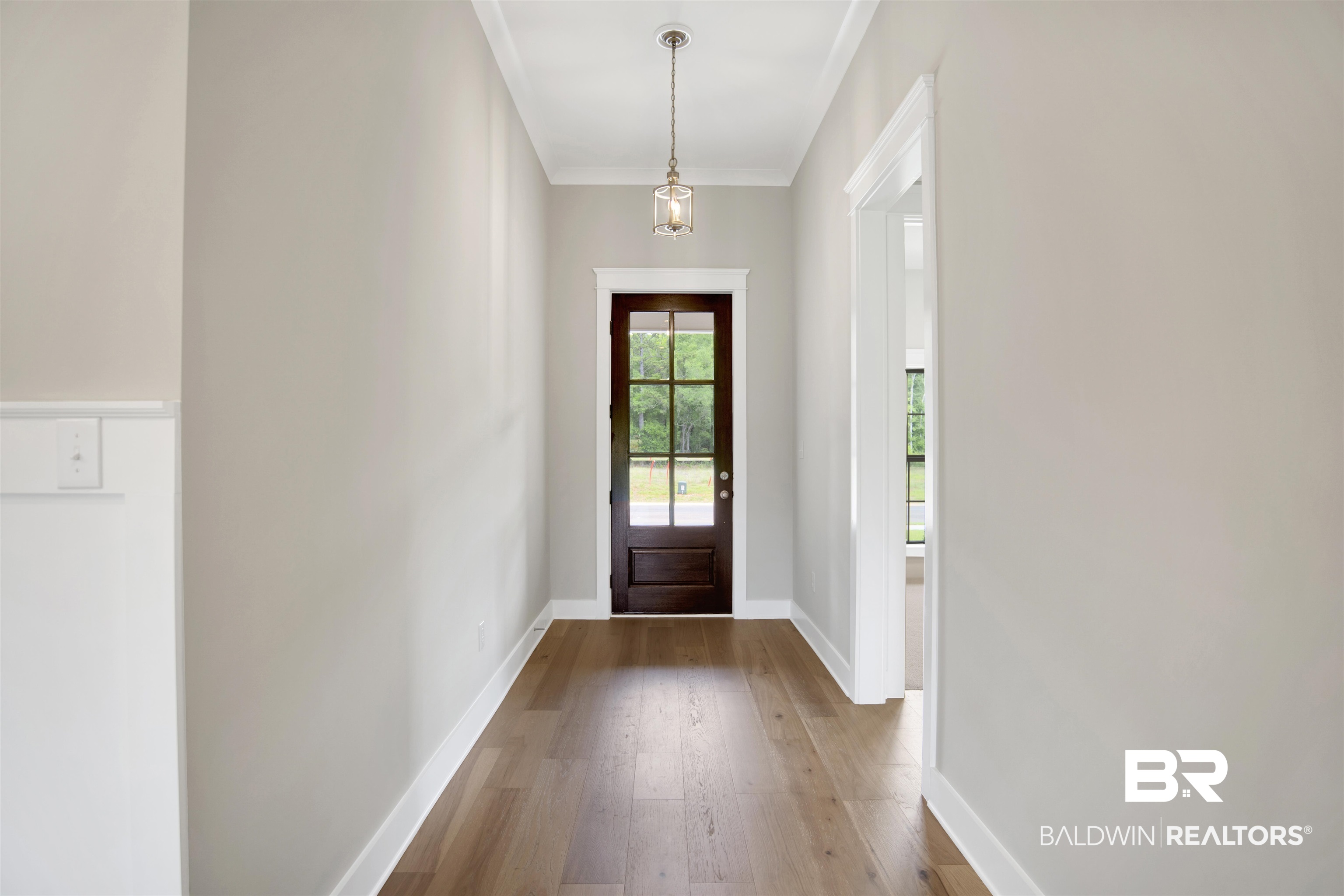 27331 Patch Pl Loop Daphne, AL 36526 - Photo 5 of 62 Doorway to outside featuring hardwood / wood-style floors and crown molding