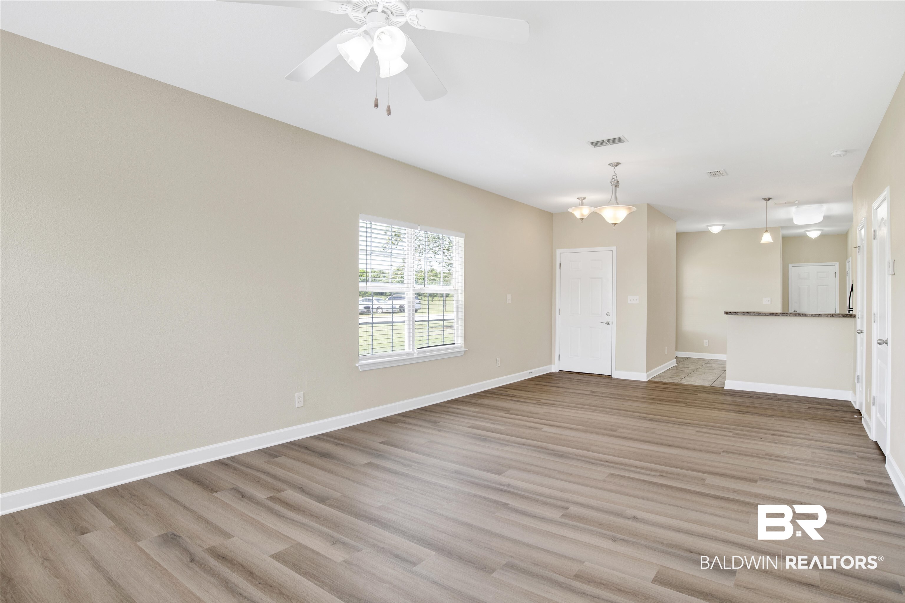 2002 Shelene Way Foley, AL 36535 - Photo 5 of 23 Unfurnished living room with light wood-style flooring and ceiling fan