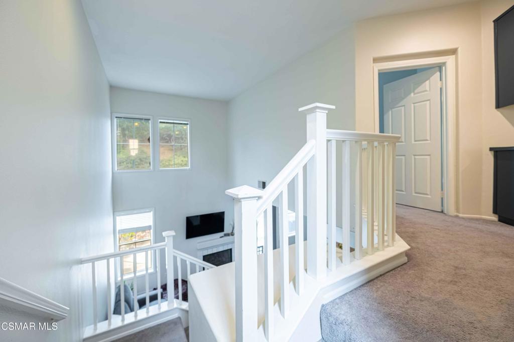 580 Fenwick Way, Unit C Simi Valley, CA 93065 - Photo 20 of 39 a view of staircase with white walls and a window