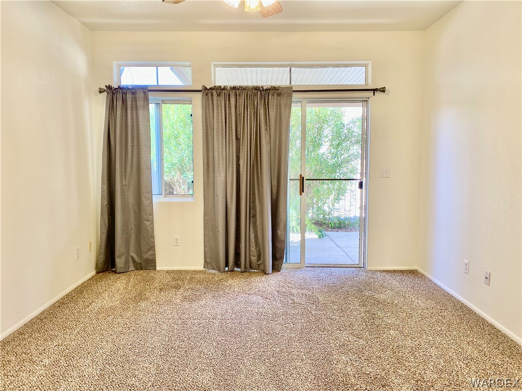 3171 Partridge Run Street Laughlin, NV 89029 - Photo 16 of 36 a view of a big room with wooden floor and windows