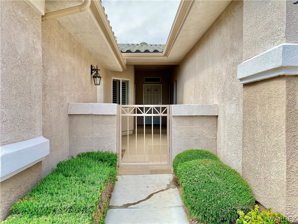 3171 Partridge Run Street Laughlin, NV 89029 - Photo 2 of 36 a view of a house with porch and garden