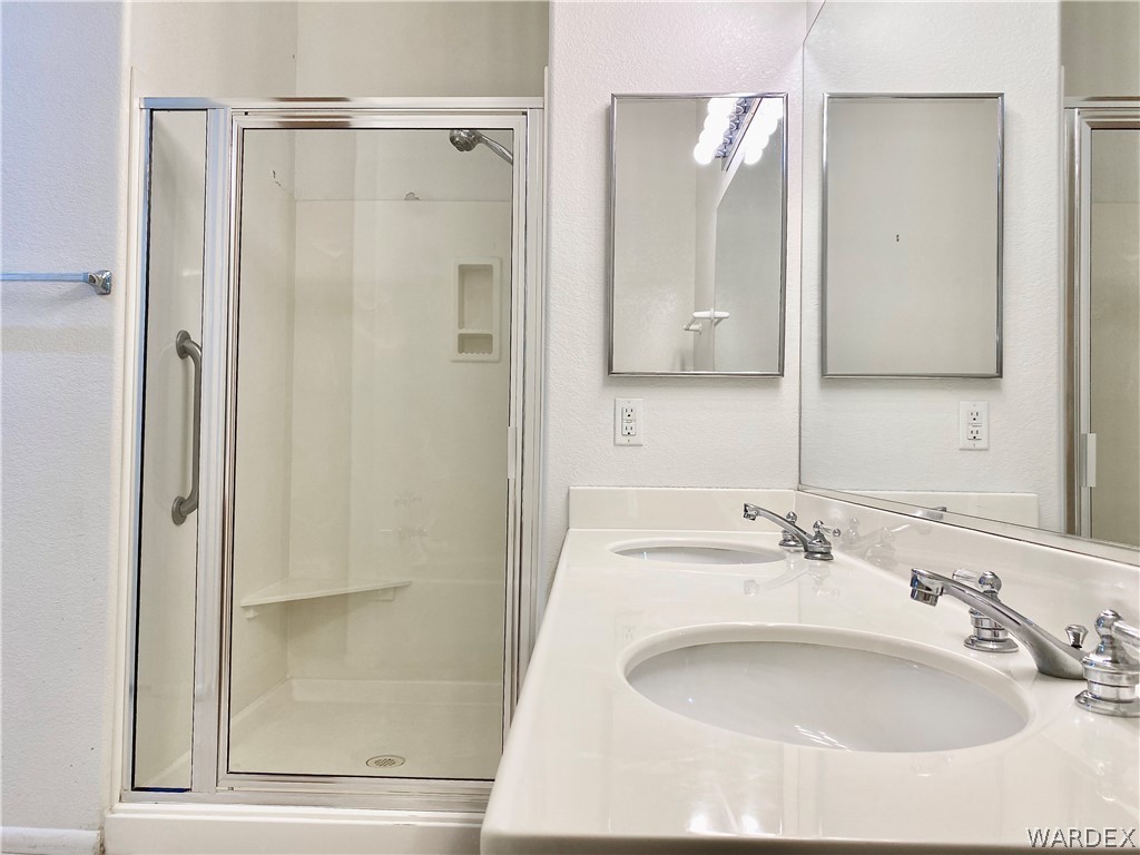 3171 Partridge Run Street Laughlin, NV 89029 - Photo 22 of 36 a bathroom with a sink and a mirror