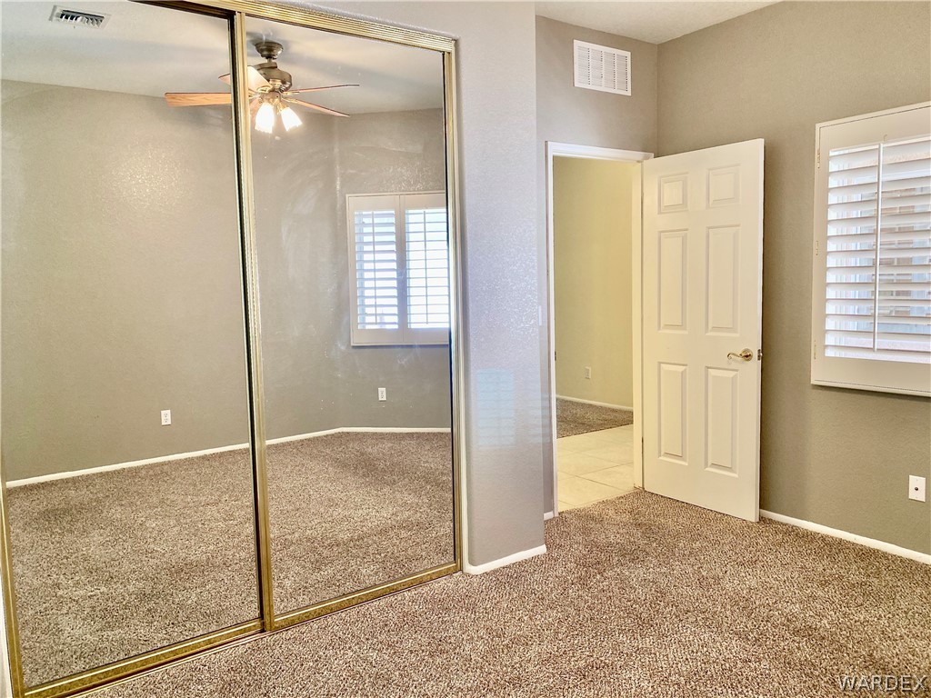 3171 Partridge Run Street Laughlin, NV 89029 - Photo 25 of 36 an empty room with windows and closet