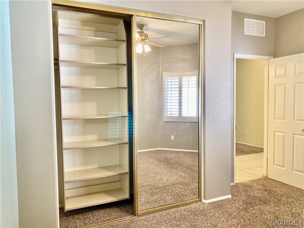 3171 Partridge Run Street Laughlin, NV 89029 - Photo 27 of 36 a view of an empty room with closet and a window