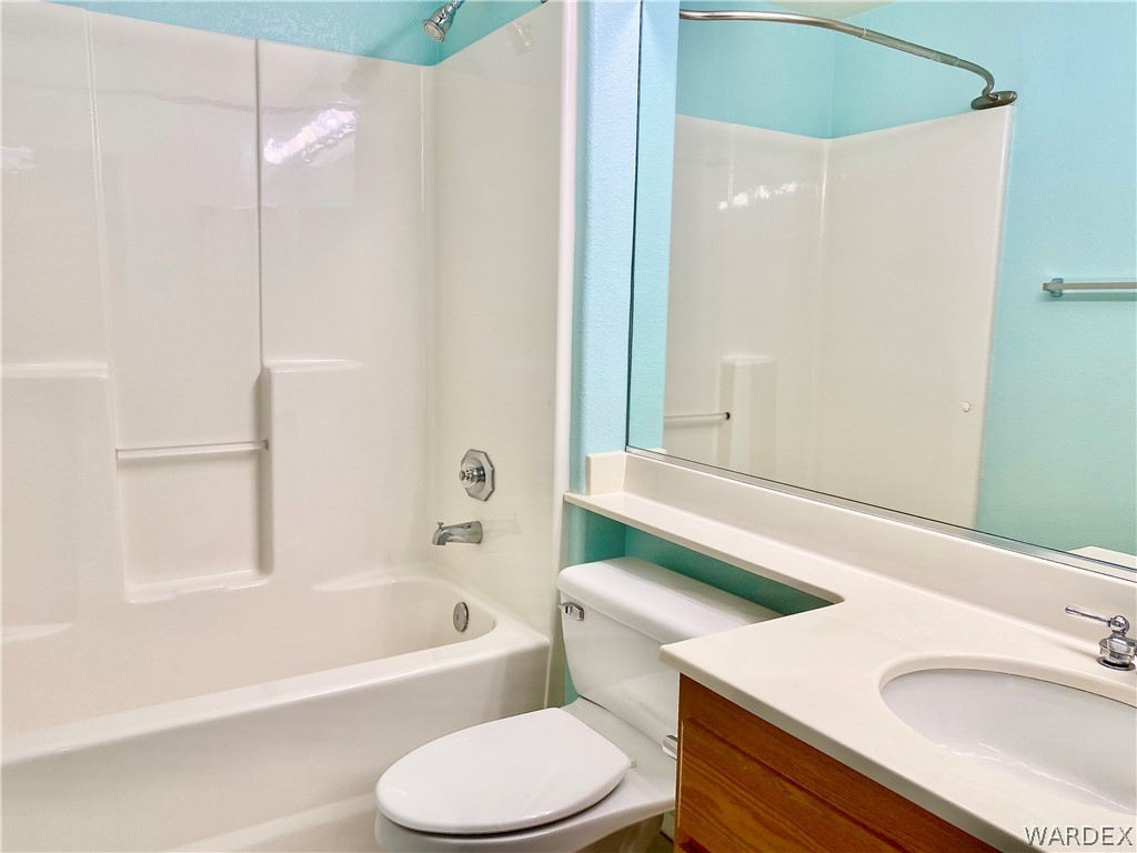 3171 Partridge Run Street Laughlin, NV 89029 - Photo 28 of 36 a bathroom with a sink toilet and shower