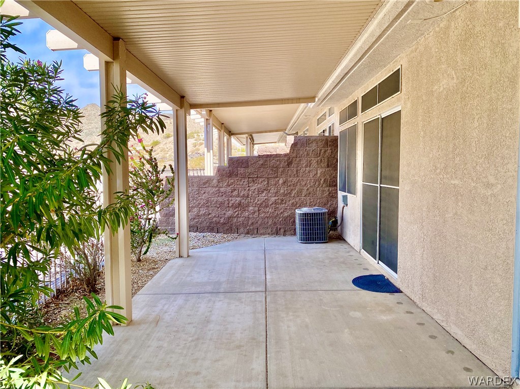 3171 Partridge Run Street Laughlin, NV 89029 - Photo 35 of 36 a view of a porch with chairs and potted plants