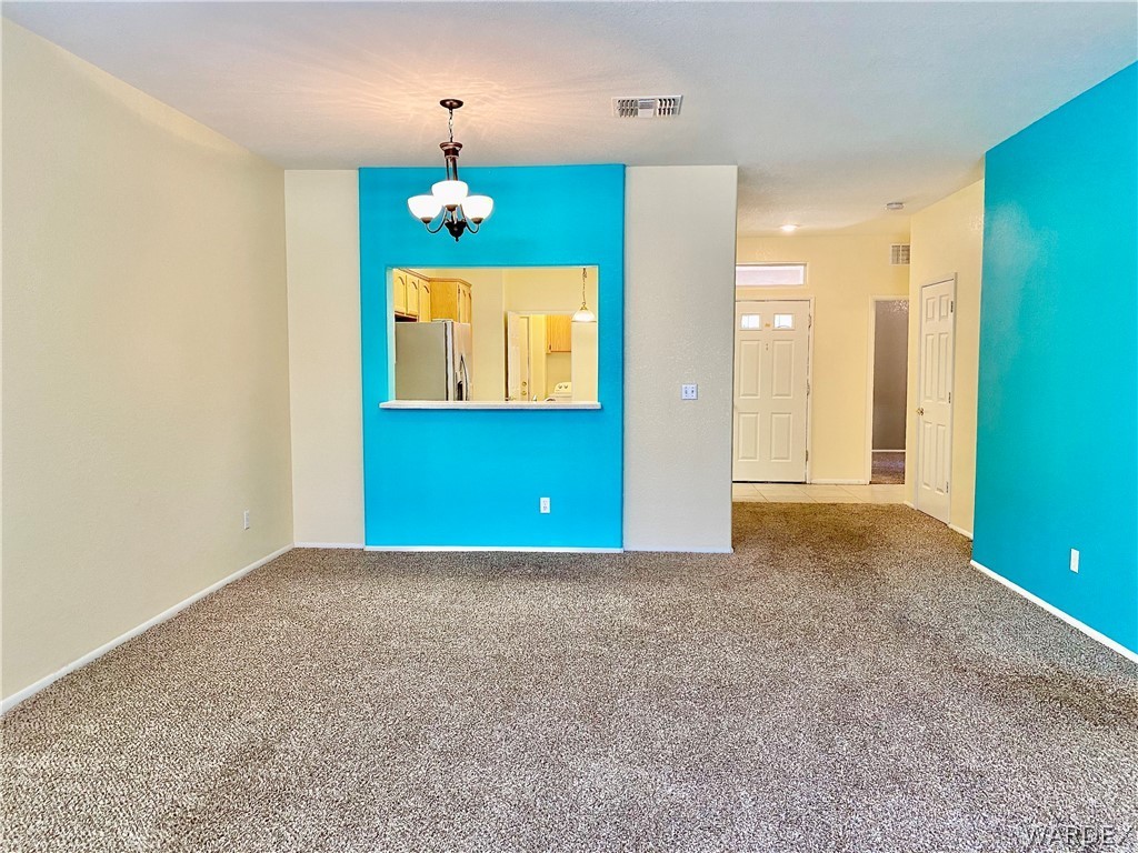 3171 Partridge Run Street Laughlin, NV 89029 - Photo 5 of 36 wooden floor in an empty room with a window