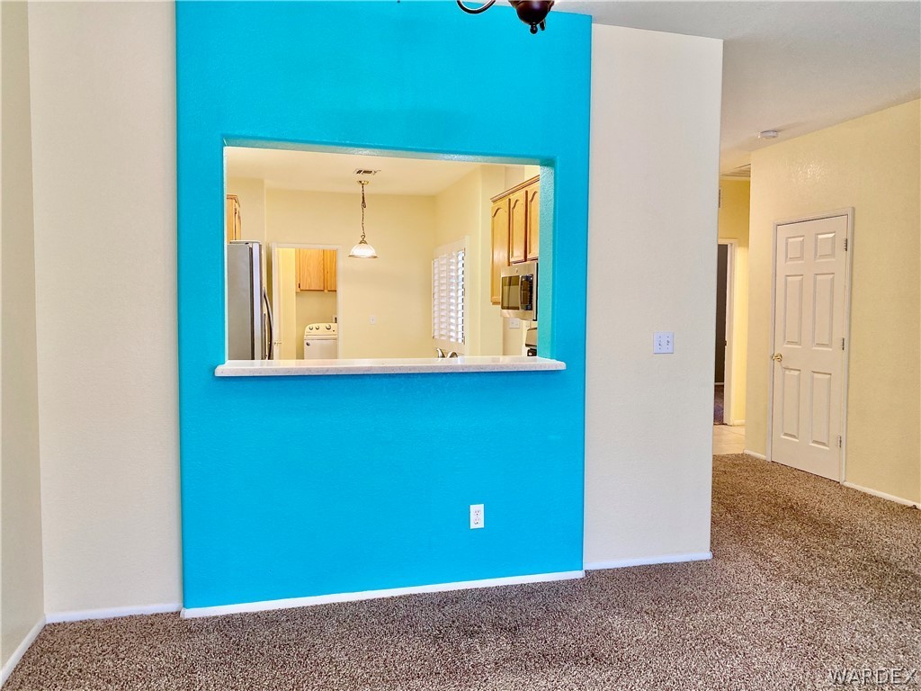 3171 Partridge Run Street Laughlin, NV 89029 - Photo 6 of 36 a view of a small space with wooden floor and a window