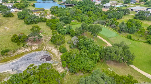 an aerial view of a houses with yard