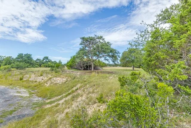 a view of a lake with houses in the back