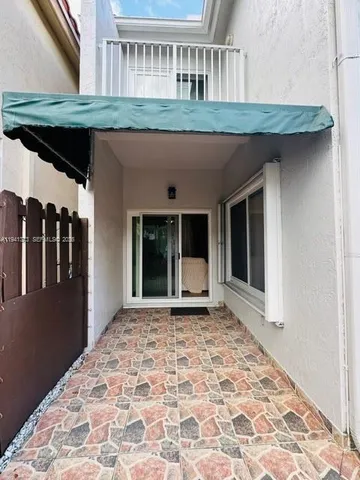 a view of a backyard of the house