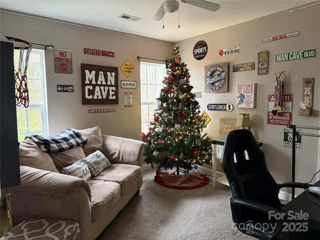a living room with furniture and flowers floor