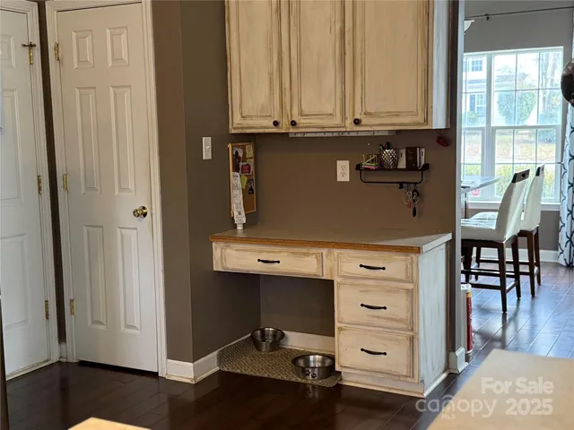 a view of room with window and wooden floor