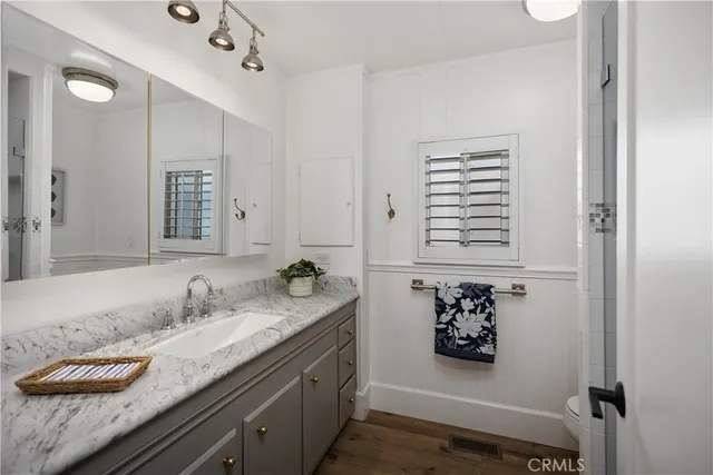 a view of a patio with couches table and chairs and potted plants