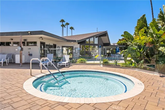 a view of a garden with a bench in a garden