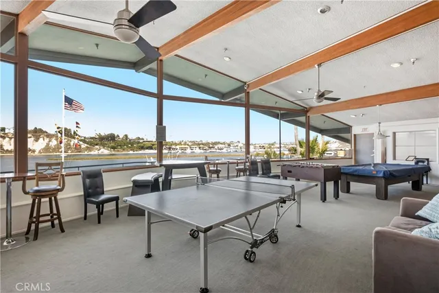 a view of a swimming pool with a table and chairs