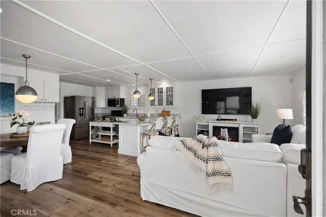 a living room with fireplace furniture and a flat screen tv