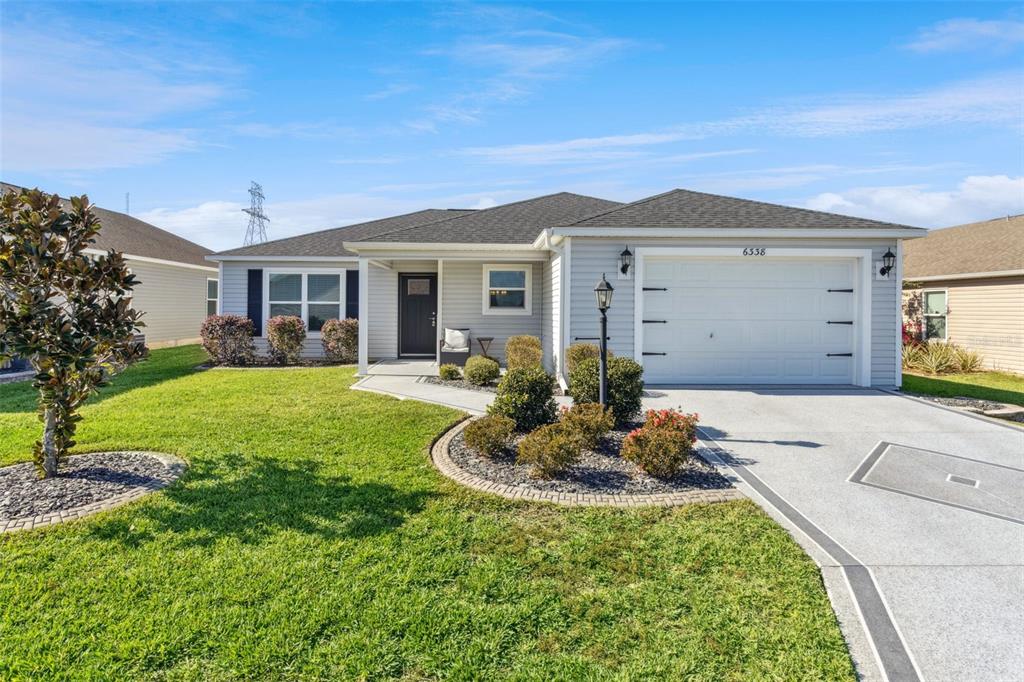 6338 Flaxmayer Road The Villages, FL 32163 - Photo 1 of 19 a front view of a house with a yard
