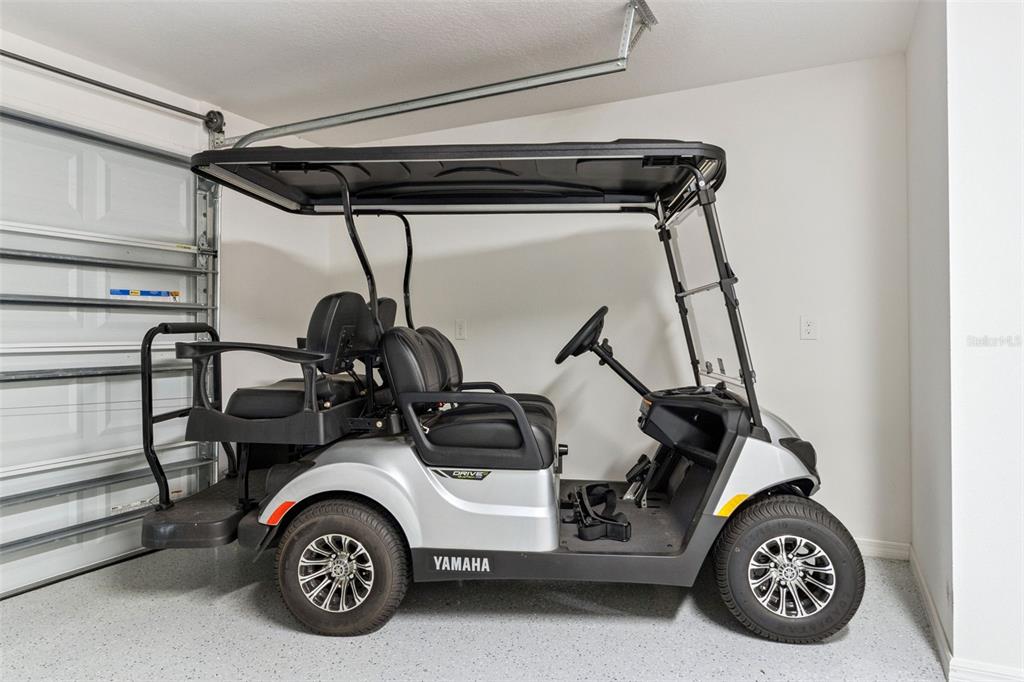 6338 Flaxmayer Road The Villages, FL 32163 - Photo 19 of 19 a car parked in a garage