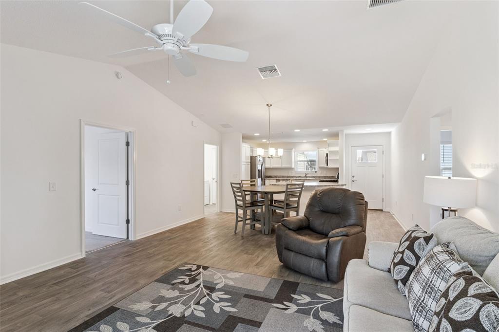 6338 Flaxmayer Road The Villages, FL 32163 - Photo 6 of 19 a living room with furniture and a wooden floor