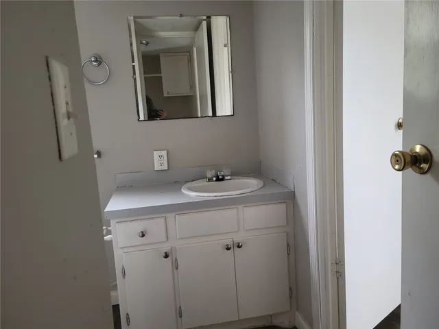 a bathroom with a sink and mirror