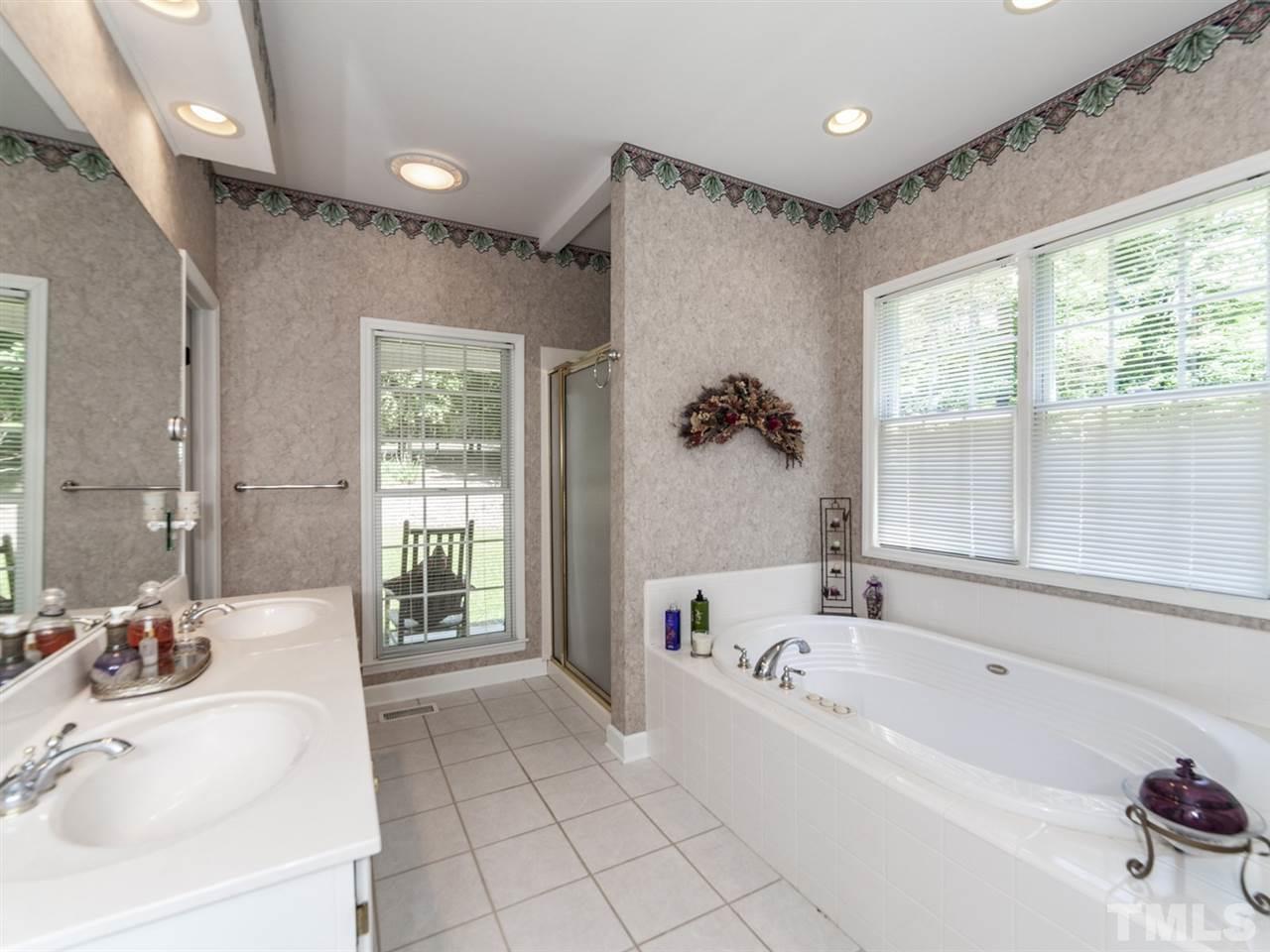 3425 Thomas Road Henderson, NC 27537 - Photo 11 of 25 a bathroom with a bathtub and a sink