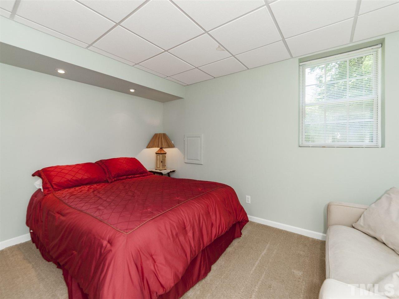 3425 Thomas Road Henderson, NC 27537 - Photo 15 of 25 a bedroom with a bed and a window