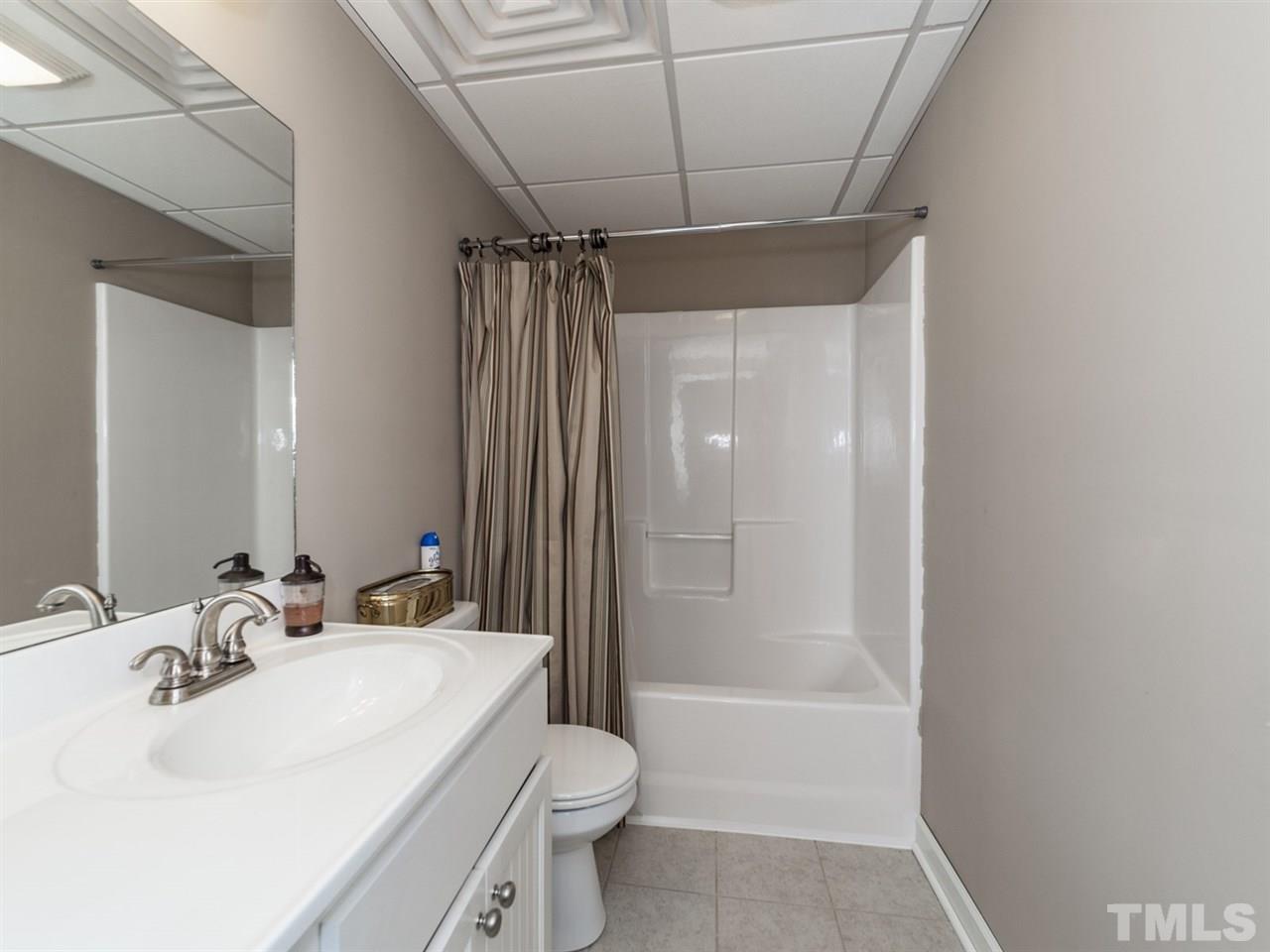 3425 Thomas Road Henderson, NC 27537 - Photo 16 of 25 a bathroom with a sink toilet and shower