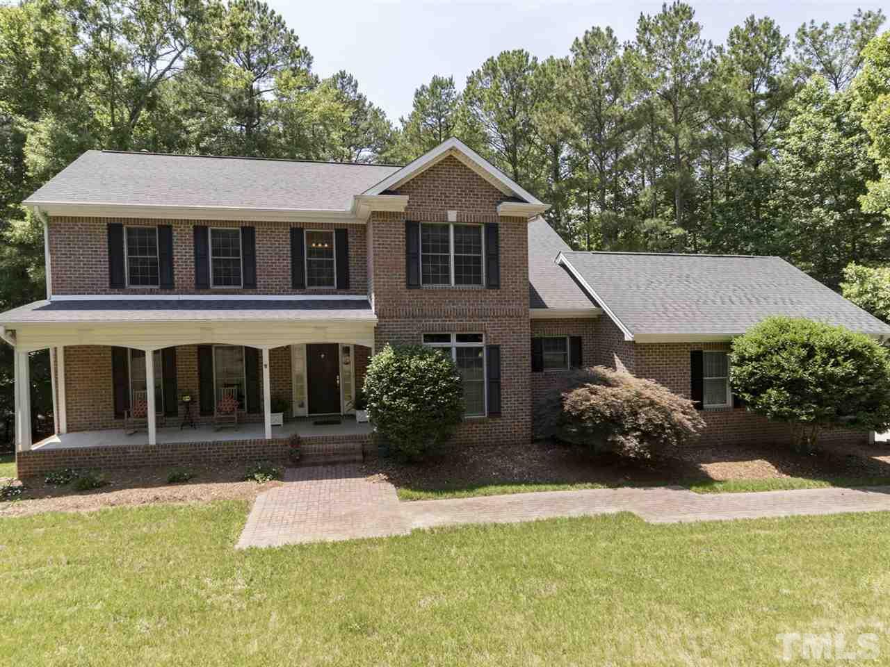 3425 Thomas Road Henderson, NC 27537 - Photo 3 of 25 a front view of a house with a yard and garage