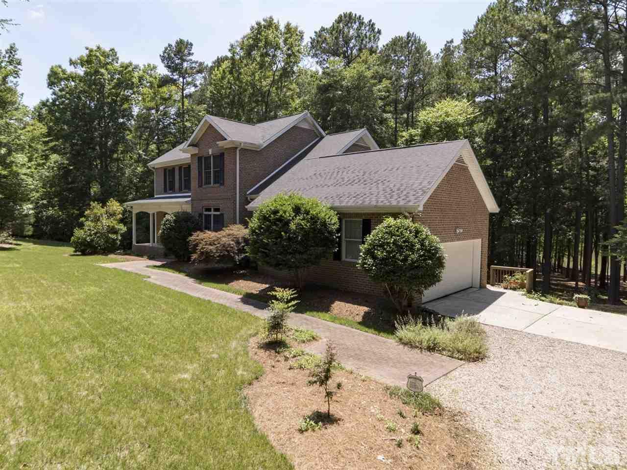 3425 Thomas Road Henderson, NC 27537 - Photo 22 of 25 a aerial view of a house with a yard and large trees