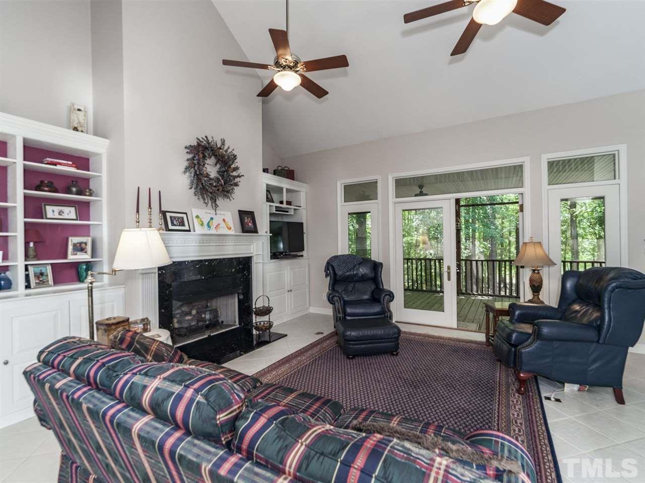 3425 Thomas Road Henderson, NC 27537 - Photo 7 of 25 a living room with furniture fireplace and a large window