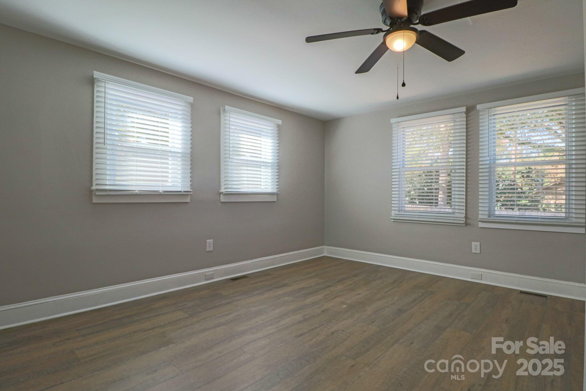 455 Stone Road Salisbury, NC 28146 - Photo 12 of 30 a view of an empty room with wooden floor and a window