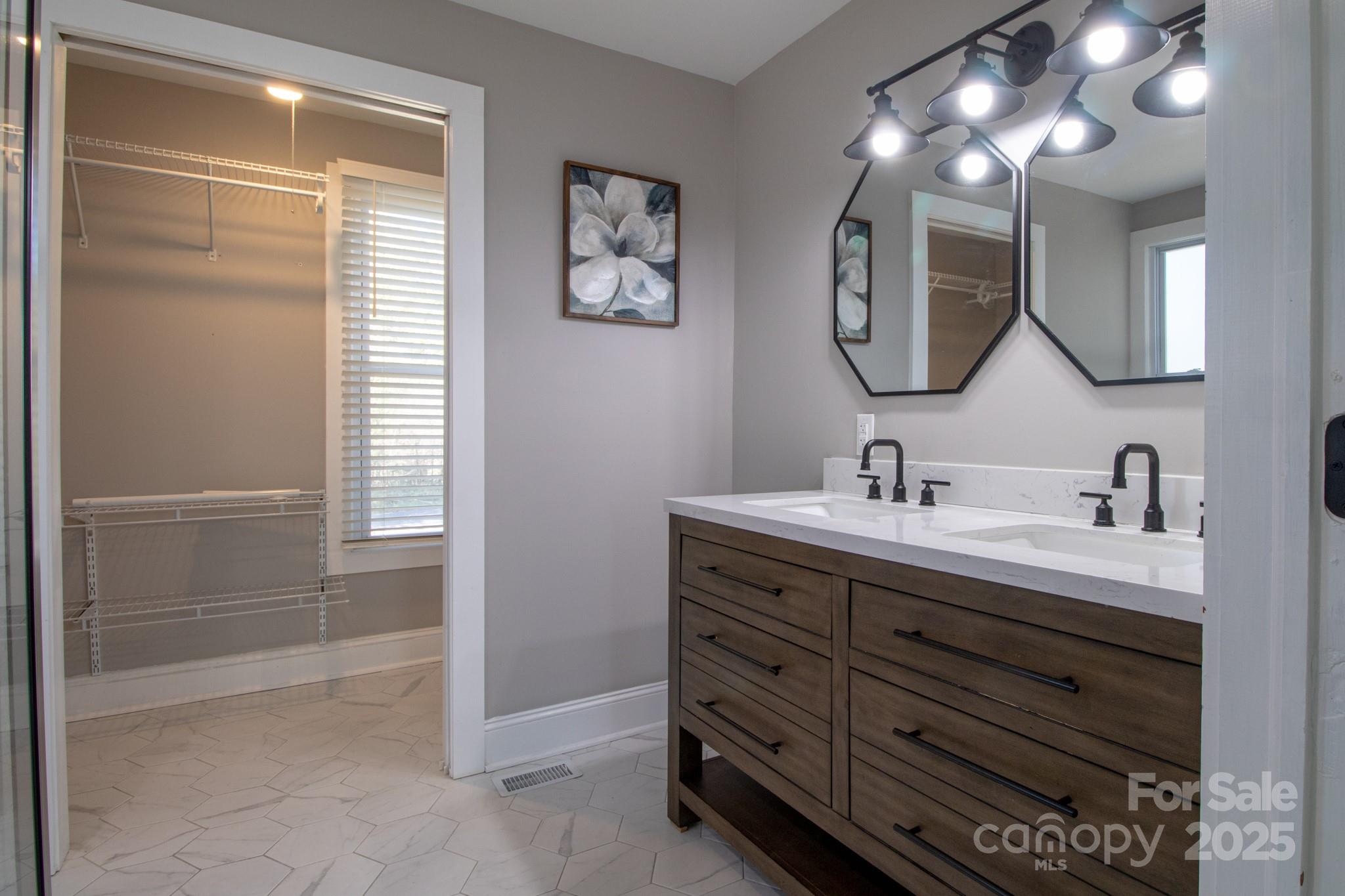 455 Stone Road Salisbury, NC 28146 - Photo 13 of 30 a bathroom with a double vanity sink and a mirror