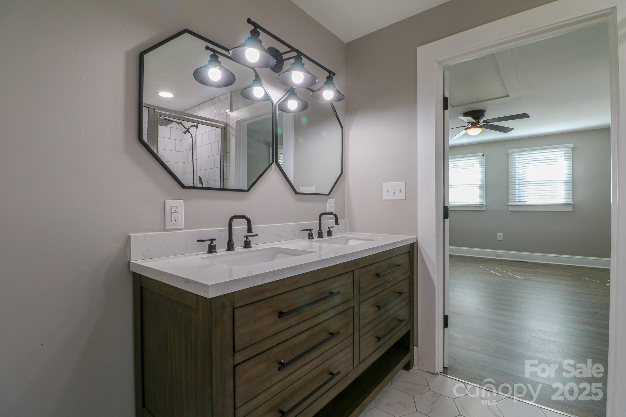 455 Stone Road Salisbury, NC 28146 - Photo 15 of 30 a bathroom with a double vanity sink and a mirror