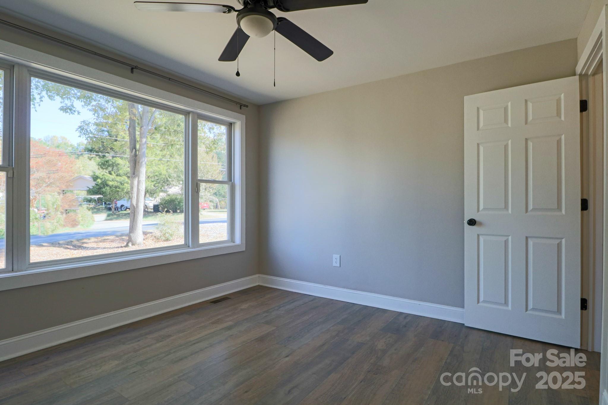 455 Stone Road Salisbury, NC 28146 - Photo 16 of 30 a view of empty room with wooden floor and fan