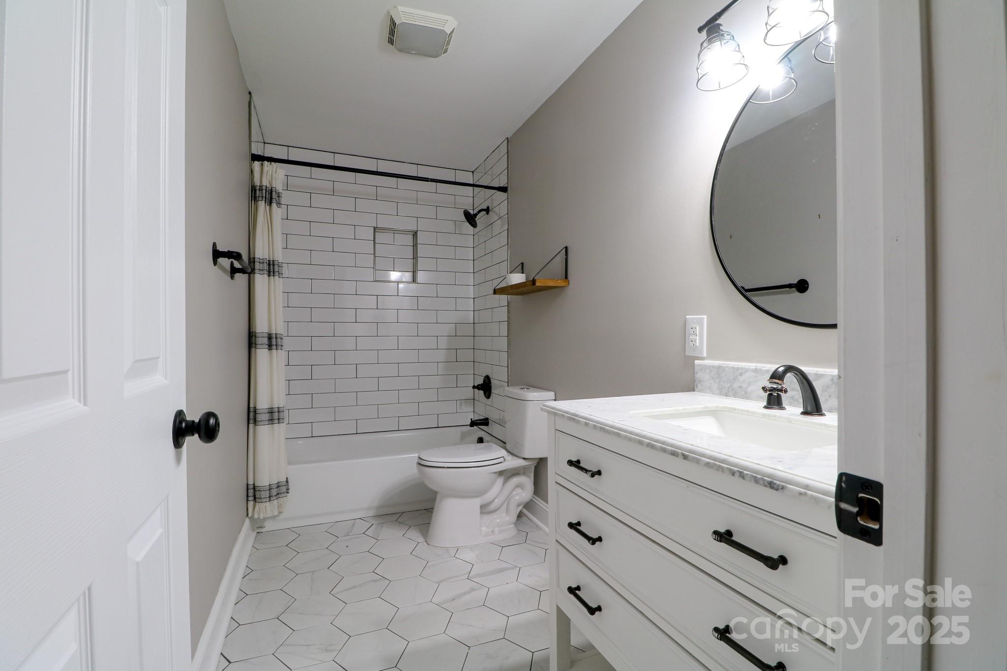 455 Stone Road Salisbury, NC 28146 - Photo 18 of 30 a bathroom with a sink toilet vanity and shower
