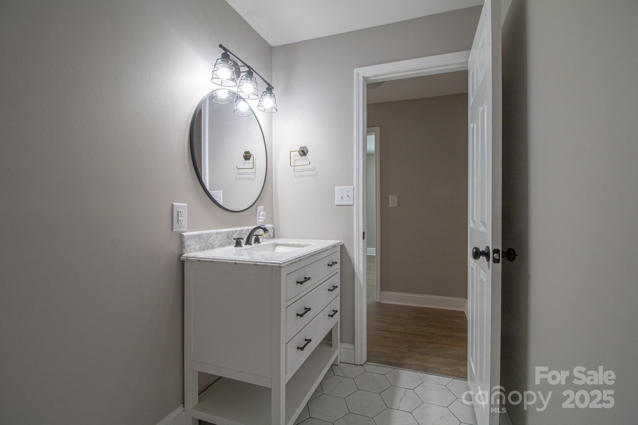 455 Stone Road Salisbury, NC 28146 - Photo 19 of 30 a bathroom with a sink and a mirror