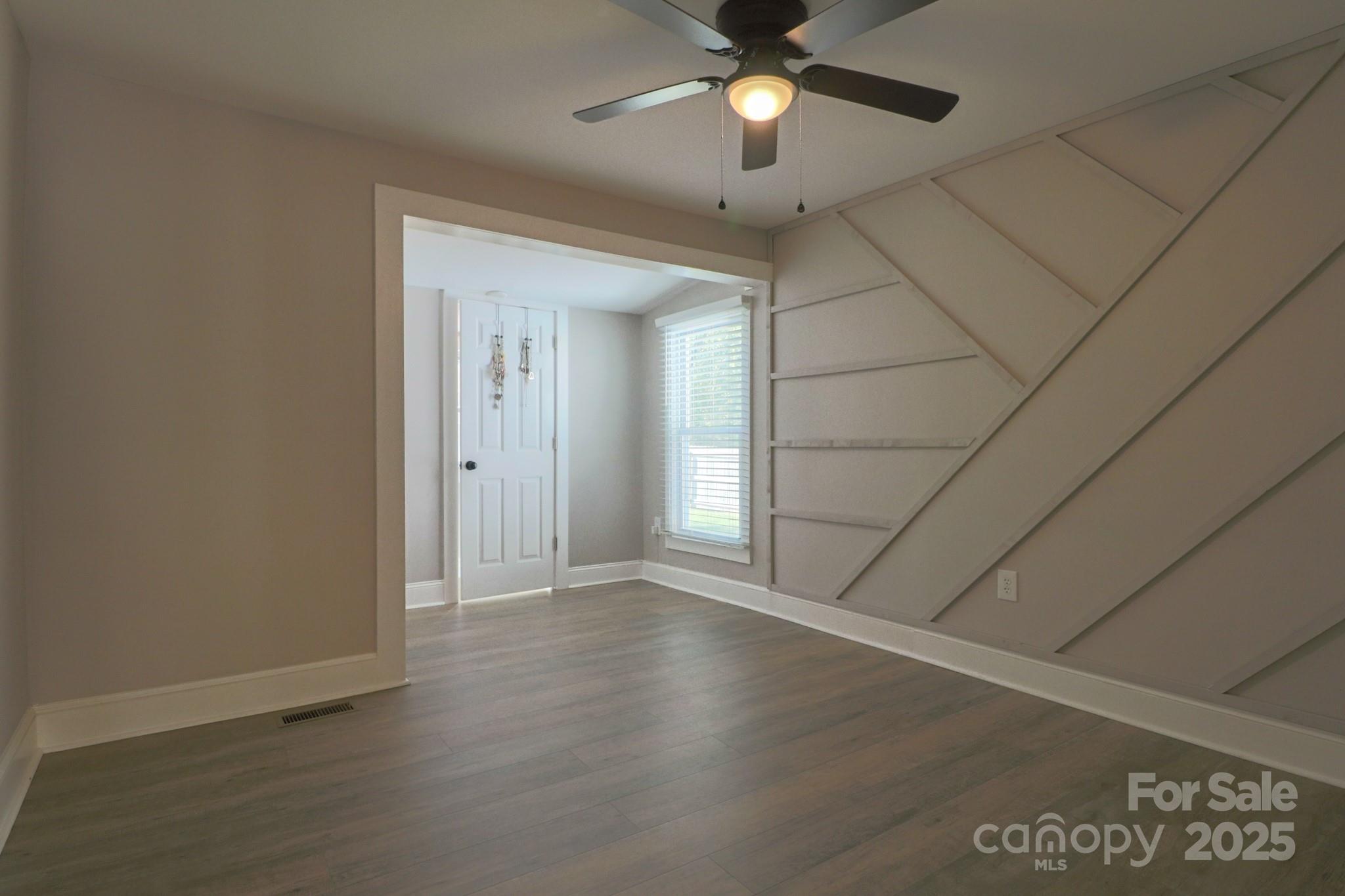 455 Stone Road Salisbury, NC 28146 - Photo 21 of 30 an empty room with wooden floor and fan