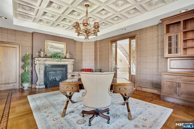 a view of a dining room with furniture wooden floor and a chandelier