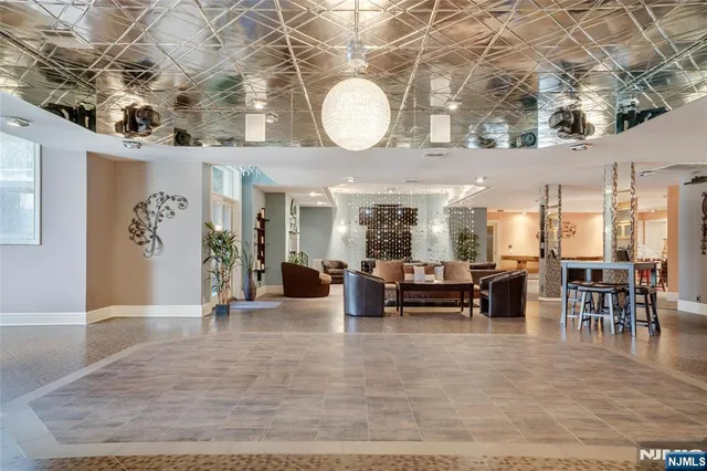 an outdoor space with lots of tables and chairs